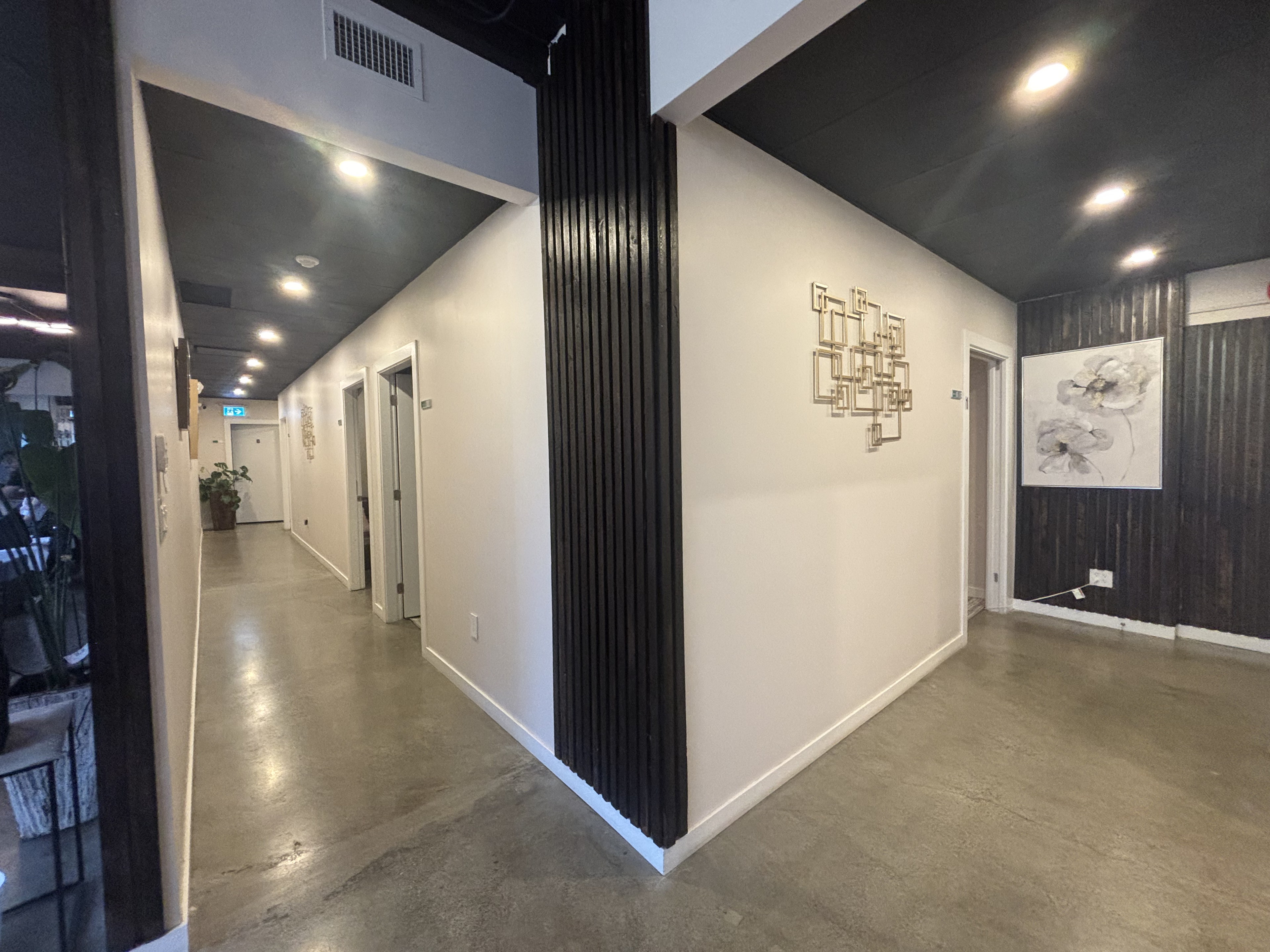 Calming sanctuary-style hallway leading to treatment rooms